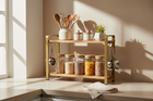 Modern kitchen storage rack neatly organized on a clean countertop, practical and stylish
Soft natural daylight, realistic shadows, warm neutral color palette, lifestyle photography
Metal and wood storage rack holding kitchen accessories, minimal props, no people
Wide horizontal composition with negative space, no text, no logos
High realism, professional product photo, non-AI look, responsive banner layout